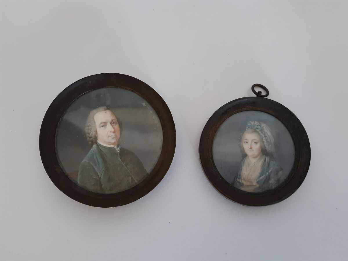 Early 19th century portraits on ivory of a gentleman and his wife