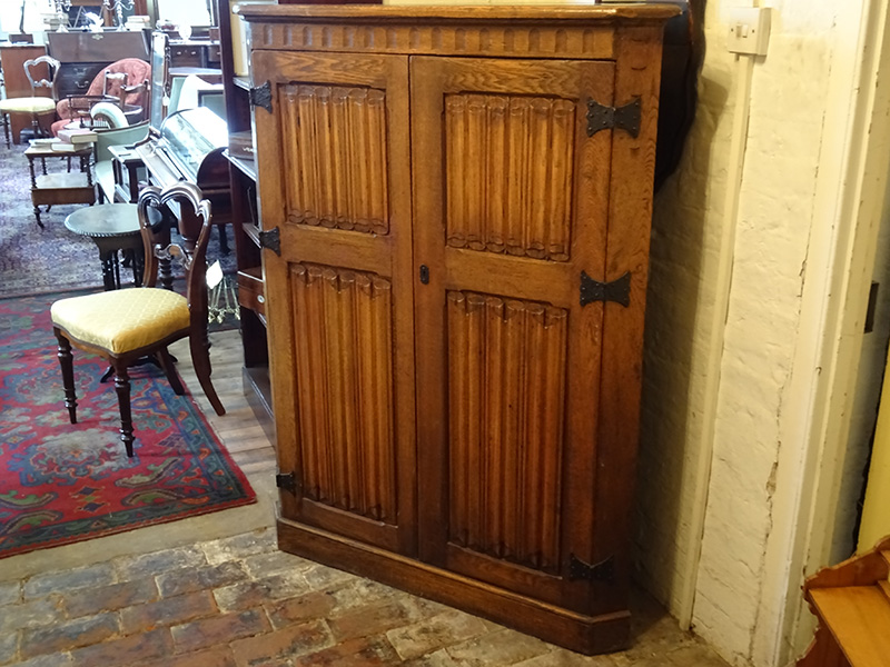 Vintage oak linenfold corner cupboard