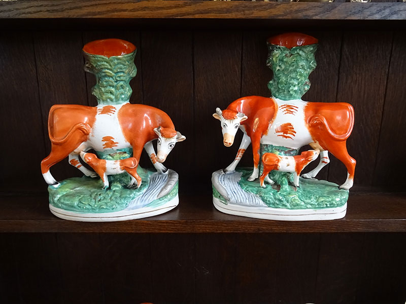 Pair of 19th.century Staffordshire cow and calf spill vases