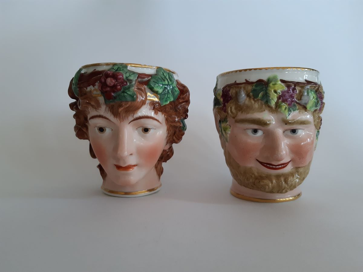 Two 18th century Derby Porcelain Bacchus head mugs