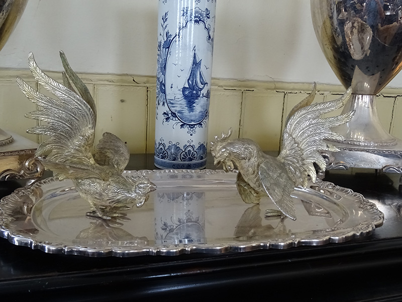 Silver plate fighting cocks