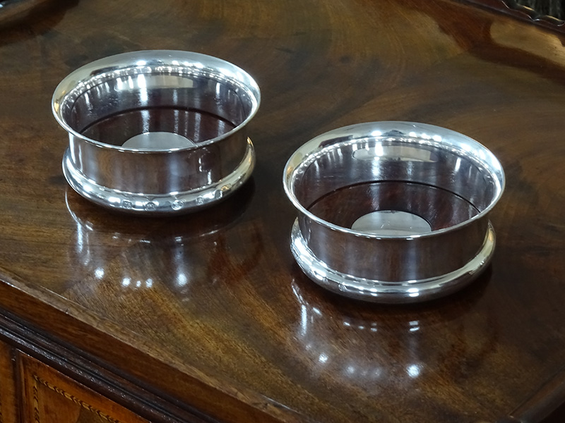 Pair Regency style silver bottle coasters
