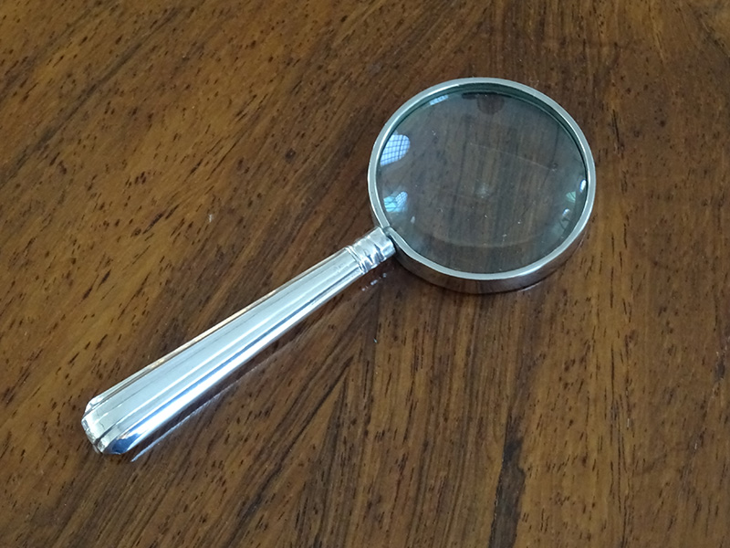silver magnifying glass