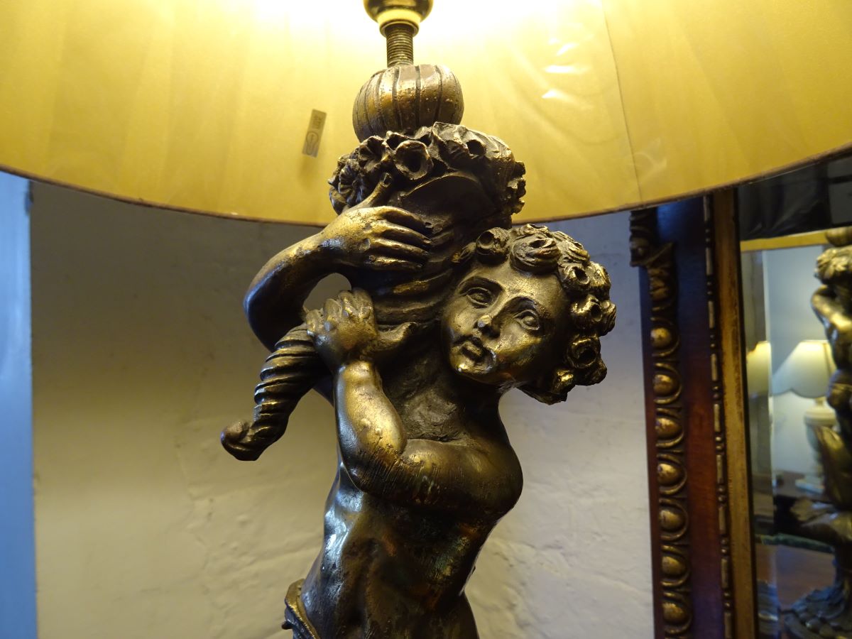 Bronzed copper table lamp in the form of a putti
