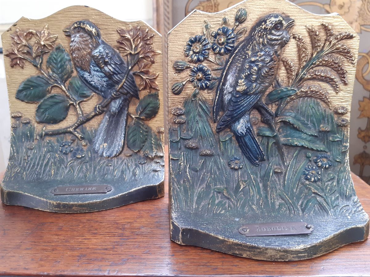 A pair of cast and bronze bookends